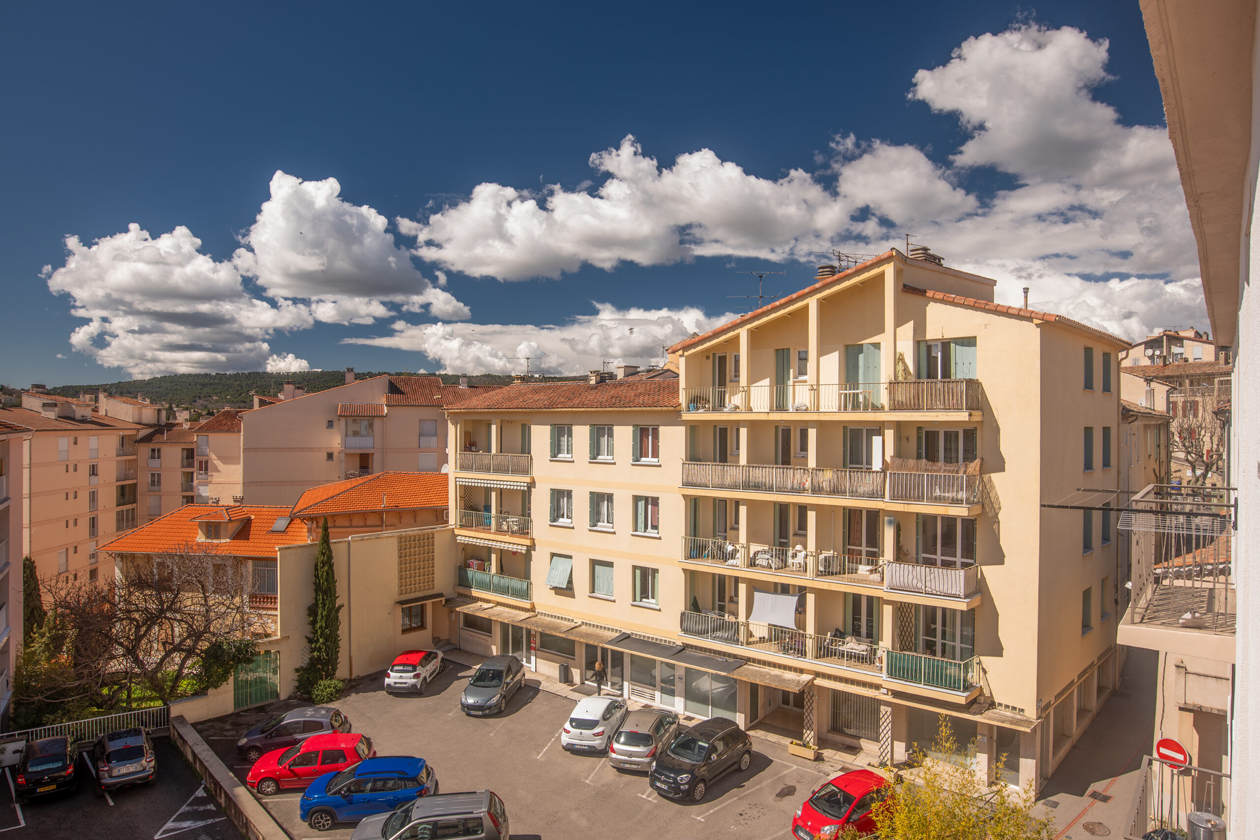 a building with cars parked in front of it