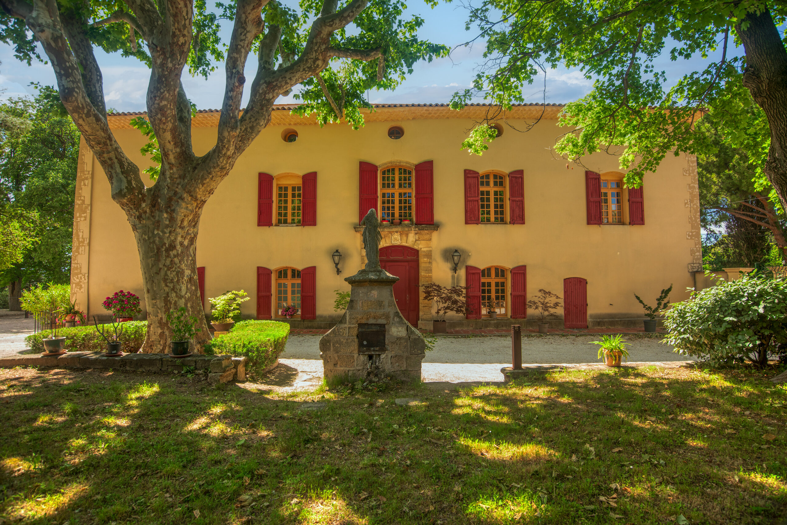 The front of a large and luxurious Provence estate.
