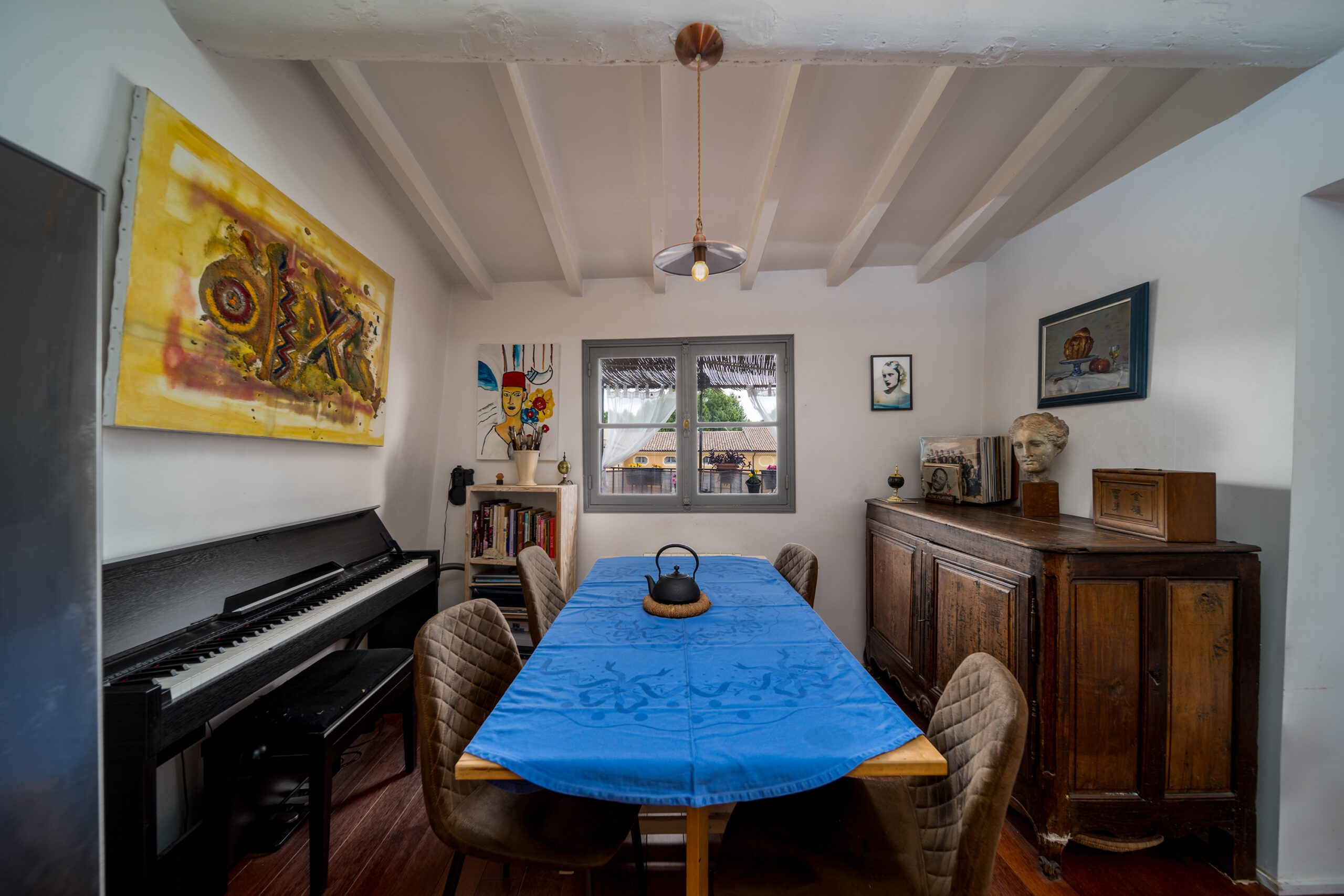 a room with a piano and a table